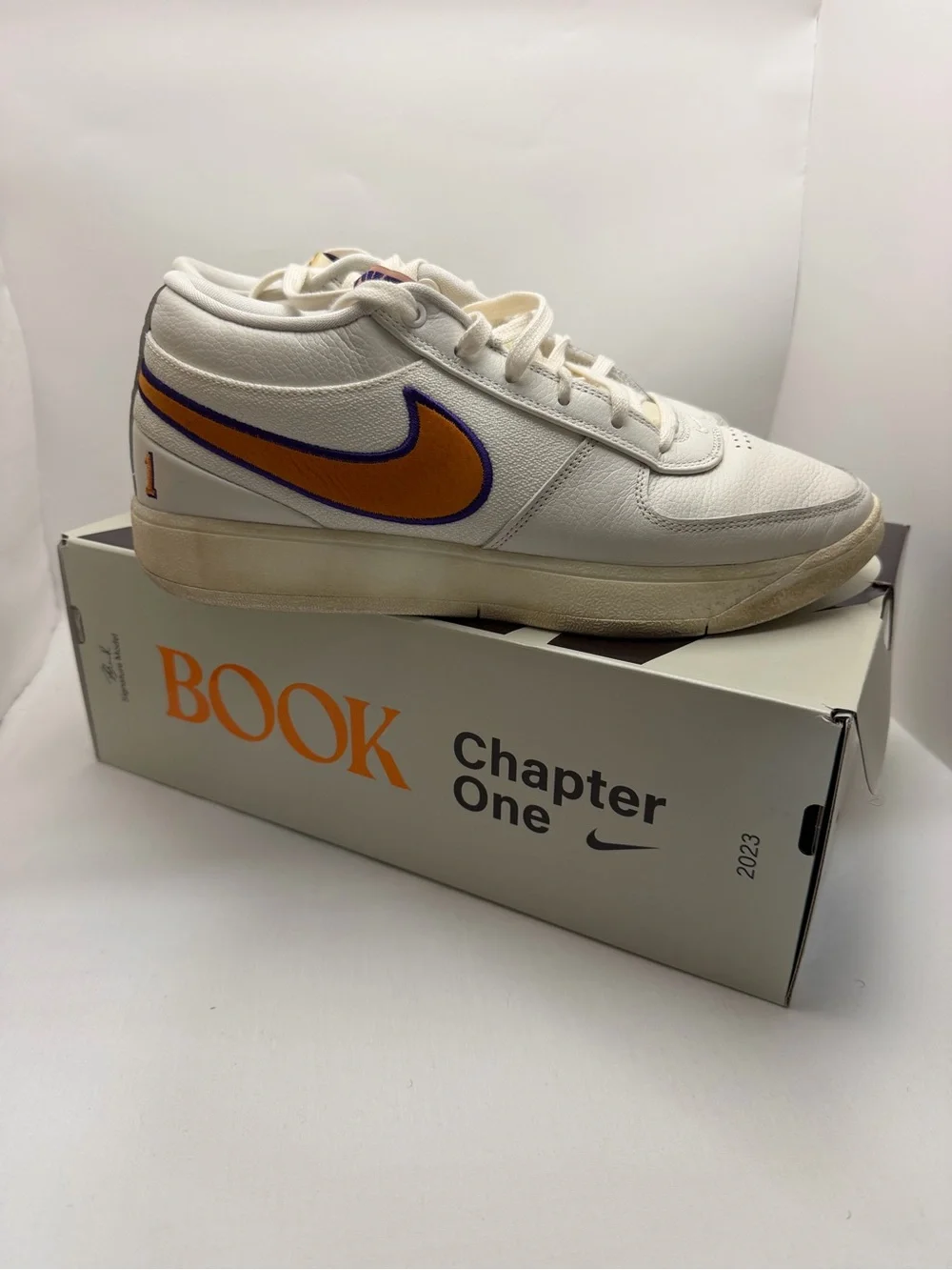 Nike mens Book 1 Sneakers Sail/Clay Orange and Purple